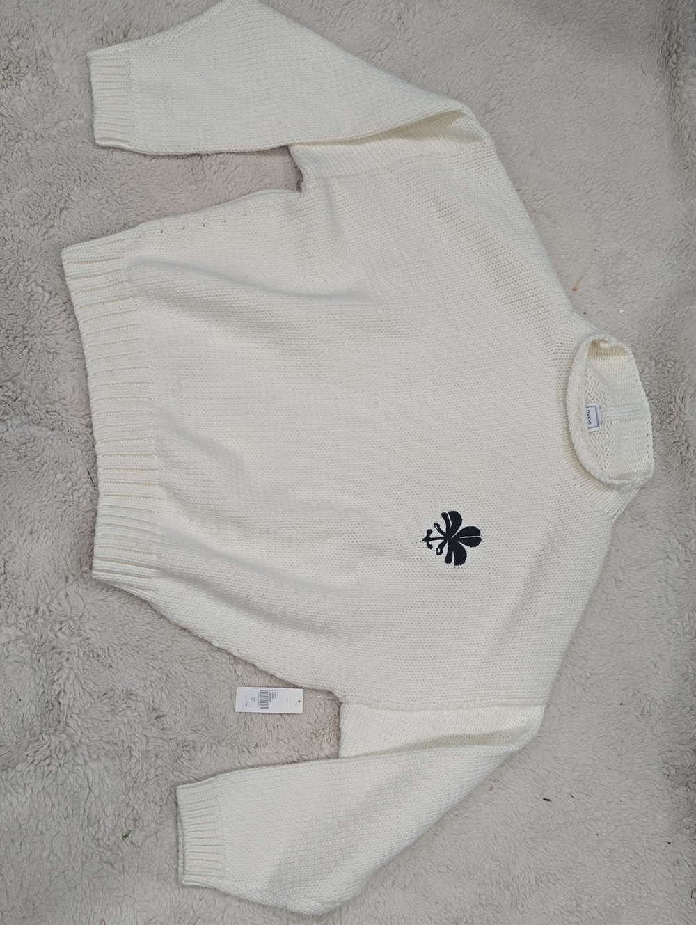 Maeve Cream Turtleneck Sweater with Black Clover Motif